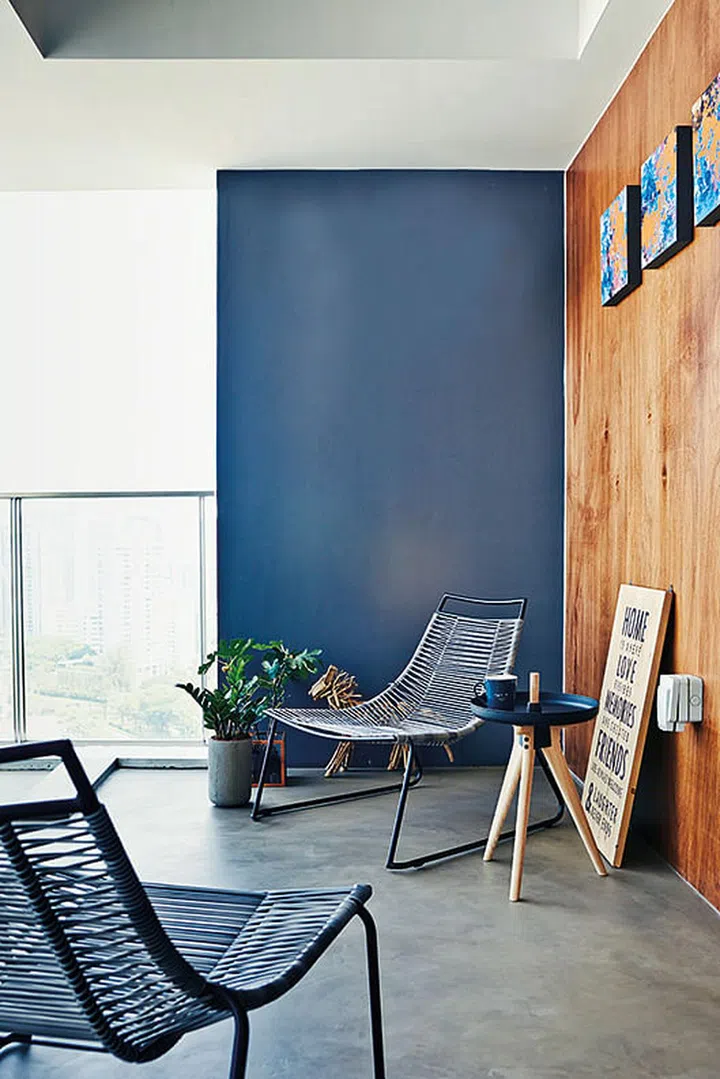 Concrete was spread over the original floor tiles in the balcony to match the theme of the home. Elvis loves the balcony, as it gives him a great view of the city.