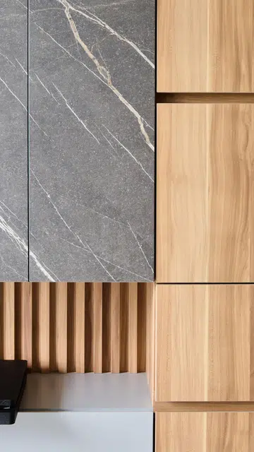 Wood-like laminate and grey marbling laminates for cabinets in this 3 plus 1 bedroom apartment in Waterfront Key condominium along Bedok Reservoir Road.