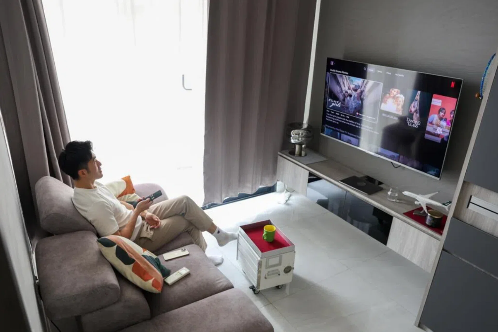 Mr Jon Phua lives in a shoebox condominium unit that forms part of a trend towards smaller private residences.