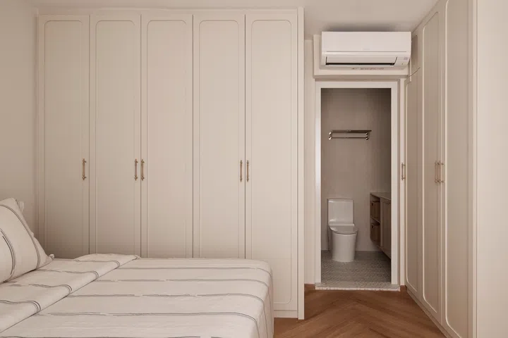 The master bedroom was similarly expanded during the renovation, allowing generous full-height wardrobes to frame the space while creating a calmer, more spacious retreat.