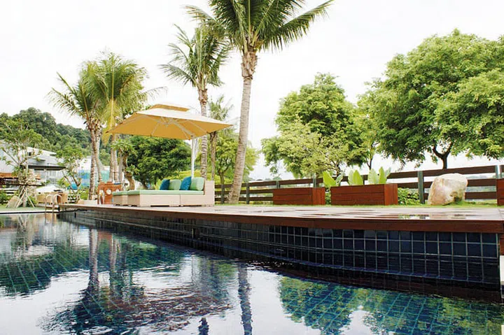 Past the palm trees and the planter boxes is the golf course.