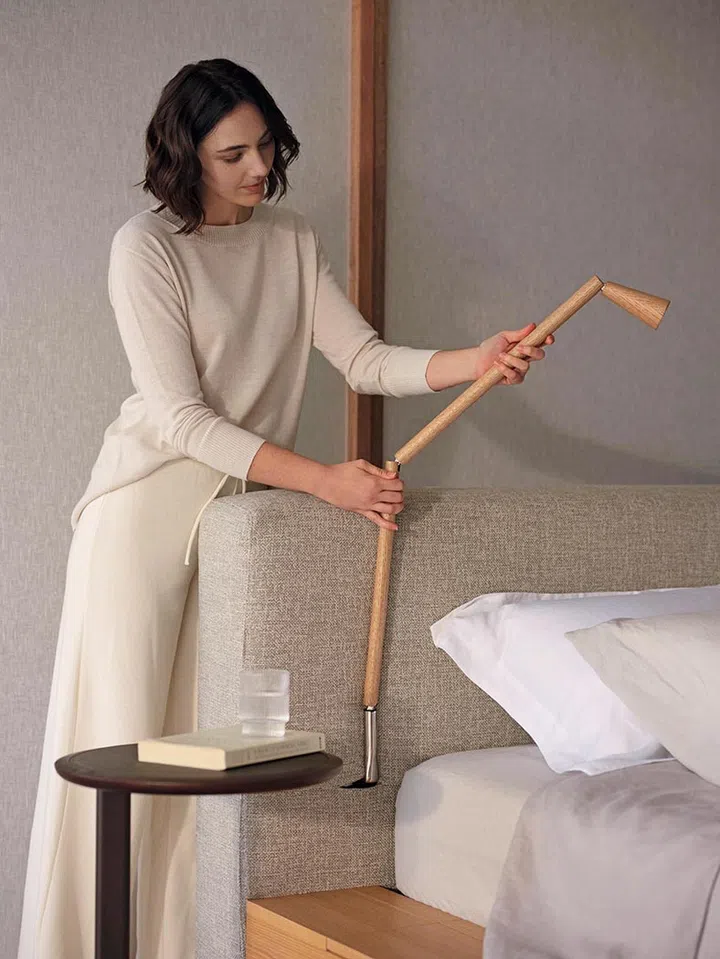 Smart bedside lamp attached to the bed headboard on the King Living Jasper bed.