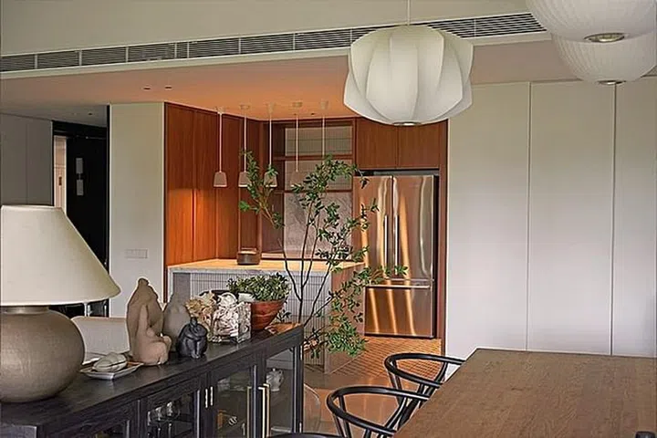 Credit: A stained wood veneer adds colour and warmth to the space. (Photo: Wynk Collaborative)