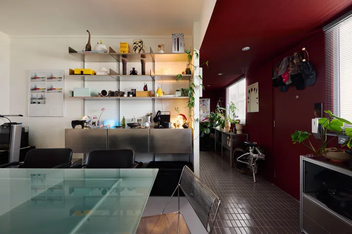 Weilun’s display shelves in the dining room are equal parts storage and styling playground, filled with objects he has collected over the years.