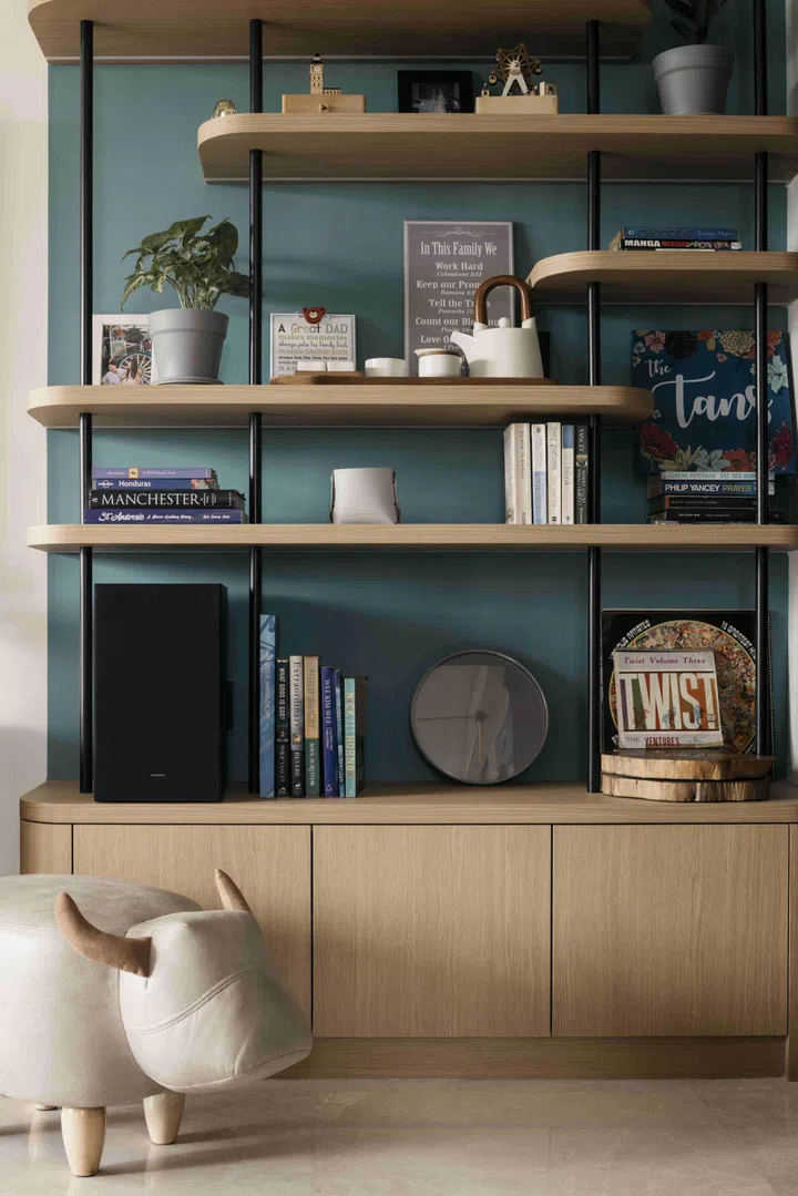 Open shelving introduces warmth and everyday function, reinforcing a space that is orderly without feeling over-styled.