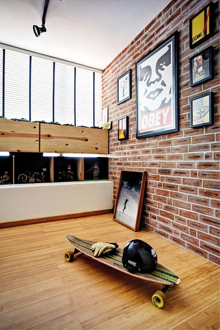 To save space, interior designer, KK, built the storage-and-display cabinet to extend from the ledge of the bay window. Gaps between the storage and display portions give it an airy, weightless feel. Interior design by Prozfile