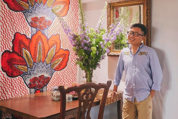 A vibrant Marimekko textile forms the backdrop to the dining area, reflecting Ivan’s willingness to mix bold contemporary pieces with traditional furnishings and collected antiques.