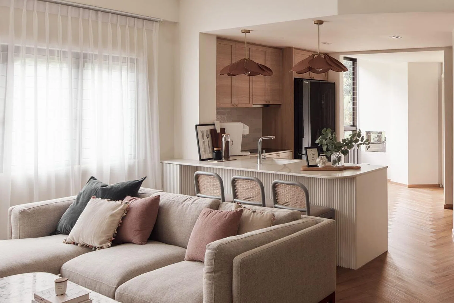The kitchen wall behind the seating area was hacked for a more spacious feel.