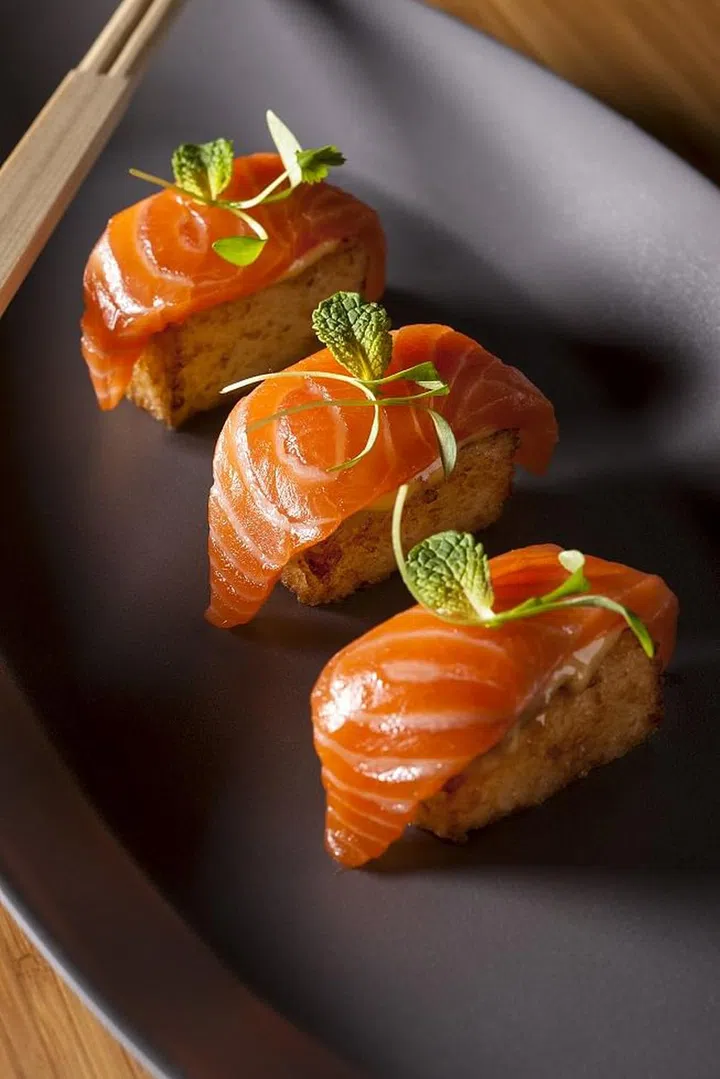 Salmon sushi wth crispy rice and chipotle mayonnaise and ponzu prepared by Chef Jean Georges and Chris Beischer of Mercer kitchen restaurant NYC.