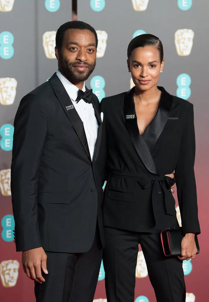 LONDON, ENGLAND - FEBRUARY 18:  Chiwetel Ejiofor (L) and Frances Aaternir attend the EE British Academy Film Awards (BAFTAs) held at Royal Albert Hall on February 18, 2018 in London, England.  (Photo by Samir Hussein/WireImage)