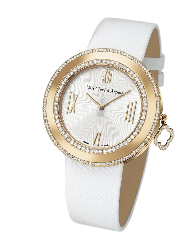 Charms watch, 38 mm. 38 mm rose gold case; rose gold bezel, 2 rows of diamonds; rotating rose gold charm, round diamonds; cream lacquer dial, Alhambra motif; rose gold crown, round diamond; two interchangeable bracelets, black satin, rose gold pin buckle or white satin, rose gold pin buckle; DEF, IF to VVS diamonds; quartz movement