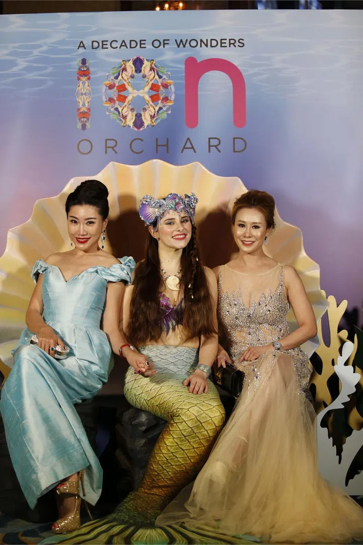 Shann Sok & Datin Chris Teo with the mermaid at ION Orchard's display