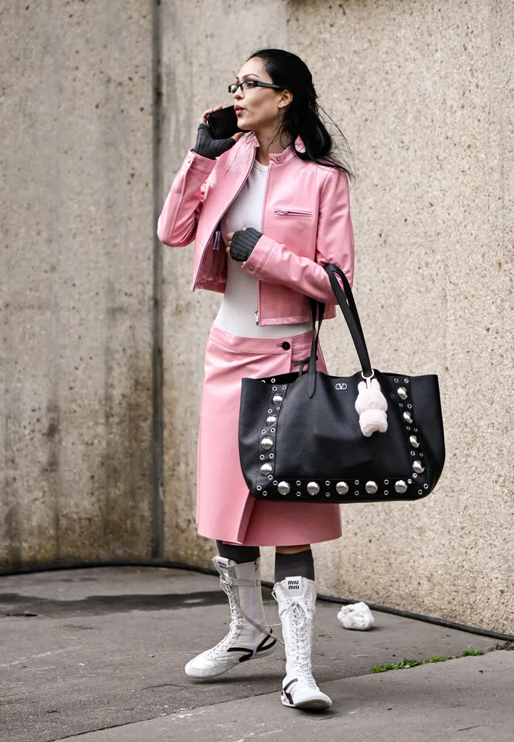 PARIS, FRANCE - MARCH 11: Amelia Gray is seen wearing a pink Miu Miu jacket, white top, pink Miu Miu skirt, Miu Miu boots, black bag and black gloves outside the Miu Miu show during the Womenswear Fall/Winter 2025/2026 as part of Paris Fashion Week on March 11, 2025 in Paris, France. (Photo by Daniel Zuchnik/Getty Images)