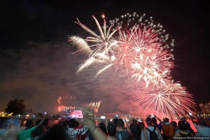 ST09082016_1622174790/ Marcus Tan/ National Day Parade (NDP) 2016 at Singapore Sports Hub (Marcus Tan)Fireworks shot from opposite the stadium, next to nicoll highwayST PHOTO: MARCUS TAN