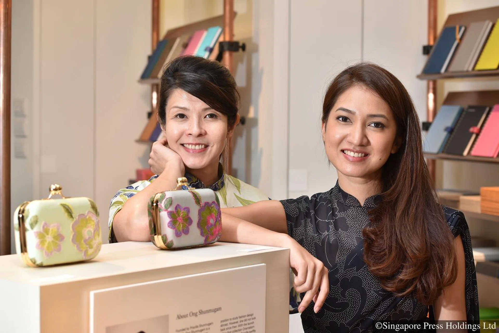 Fashion designer Priscilla Shunmugam of Ong Shunmugam and stationary company Bynd Artisan's founder Winnie Chan (left) with their collaboration collection of clutches.