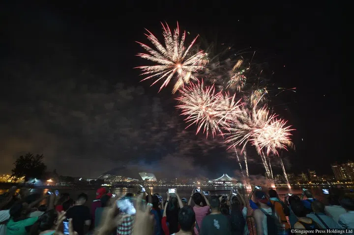 ST09082016_1622174790/ Marcus Tan/ National Day Parade (NDP) 2016 at Singapore Sports Hub (Marcus Tan)Fireworks shot from opposite the stadium, next to nicoll highwayST PHOTO: MARCUS TAN
