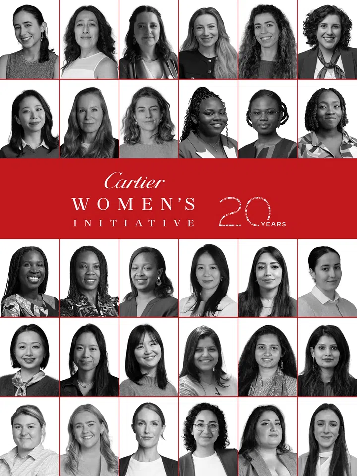 一张Cartier Women’s Initiative 20周年主题视觉图，由多位女性黑白人物肖像组成网格式排版。画面中展示来自不同国家、种族与背景的女性创业者及计划成员，她们面向镜头微笑或以自然神情呈现。中央以醒目的红色横幅展示“Cartier Women’s Initiative”标志及“20 Years”字样，整体以黑、白、红三色设计，象征项目过去20年来持续支持全球女性创业者、推动创新与社会影响力的发展。