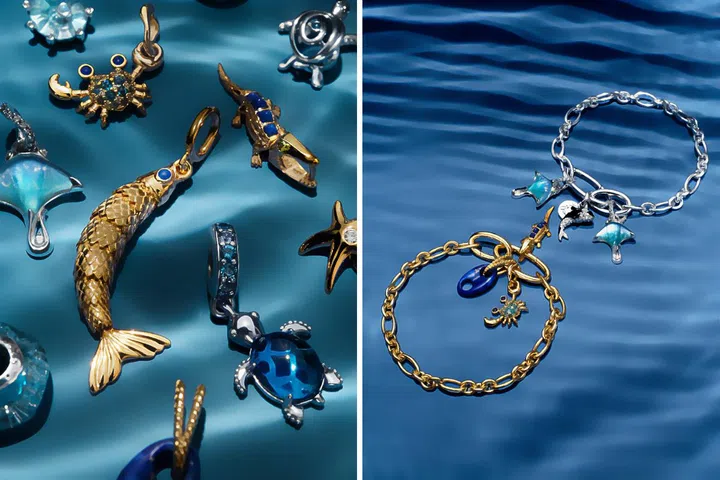 Pandora Moments charm bracelet collection featuring ocean-inspired charms, blue glass details and warm gold tones.