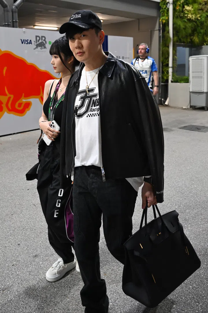 SINGAPORE, SINGAPORE - OCTOBER 11: JJ Lin and Annalisa Qi Qi in the Paddock prior to the F1 Grand Prix of Singapore at Marina Bay Street Circuit on October 11, 2026 in Singapore, Singapore. (Photo by Sam Bagnall/Sutton Images)