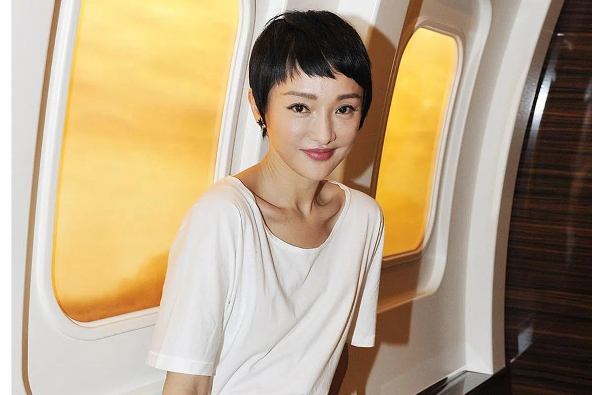 HANDOUT - Zhou Xun visits the IWC booth during the launch of the Pilot's Watches Novelties from the Swiss luxury watch manufacturer IWC Schaffhausen at the Salon International de la Haute Horlogerie (SIHH) 2016 on January 19, 2016 in Geneva, Switzerland.  (Photo by Harold Cunningham/Getty Images for IWC)