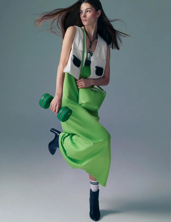 Longchamp dress $730, gilet $870, key ring (worn as necklace) $160, key ring $175, Le Roseau bag $890, Épure small bag $850, boots $1,160, socks $85