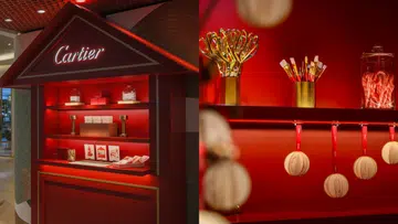 Cartier Festive Atelier 圣诞装置于新加坡精品店内呈现，红色主题空间陈列节日礼盒、丝带装饰与金色工具细节，展现品牌冬日故事灵感的沉浸式圣诞市集氛围。