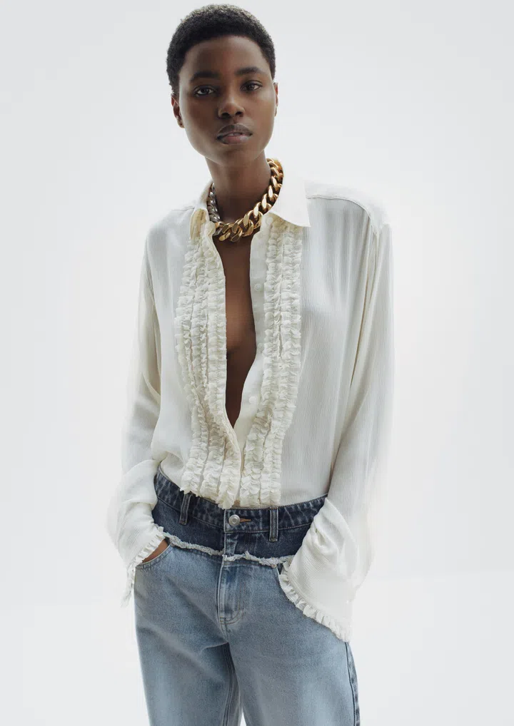 Stella McCartney H&M Collection
blouse $179.90, jeans $149.90, necklace $139.90