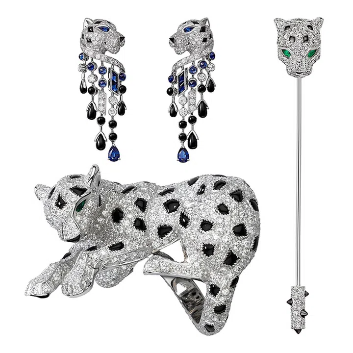 Panthère de Cartier earrings, 18K white gold (750/1000), each set with 9 sapphires, 6 onyx spots, 1 onyx nose, 9 onyx stones, and 134 brilliant-cut diamonds totaling 3.44 carats.