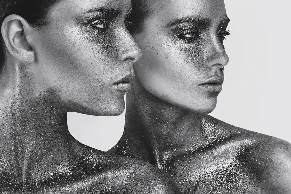 two women in gold glitters
