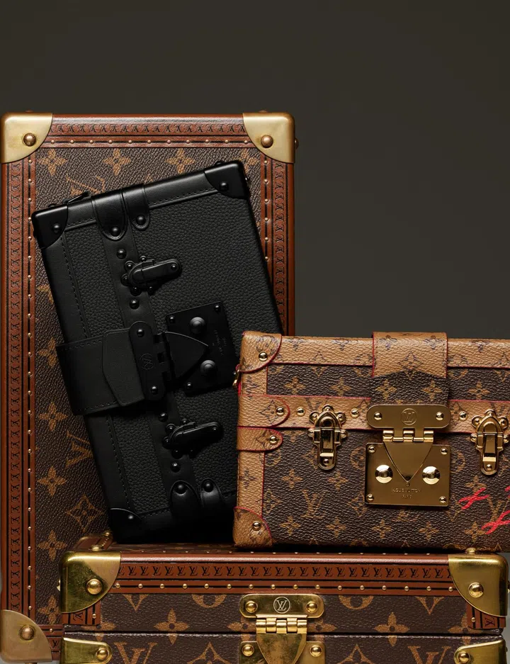 (From left) Louis Vuitton Petite Malle bag $8,500, Petite Malle bag $7,850