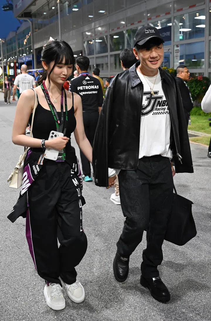 SINGAPORE, SINGAPORE - OCTOBER 11: JJ Lin and Annalisa Qi Qi in the Paddock prior to the F1 Grand Prix of Singapore at Marina Bay Street Circuit on October 11, 2026 in Singapore, Singapore. (Photo by Sam Bagnall/Sutton Images)