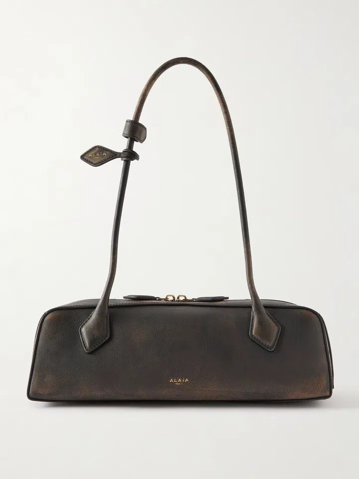 ALAÏA Le Teckel medium textured-leather shoulder bag $4,296
