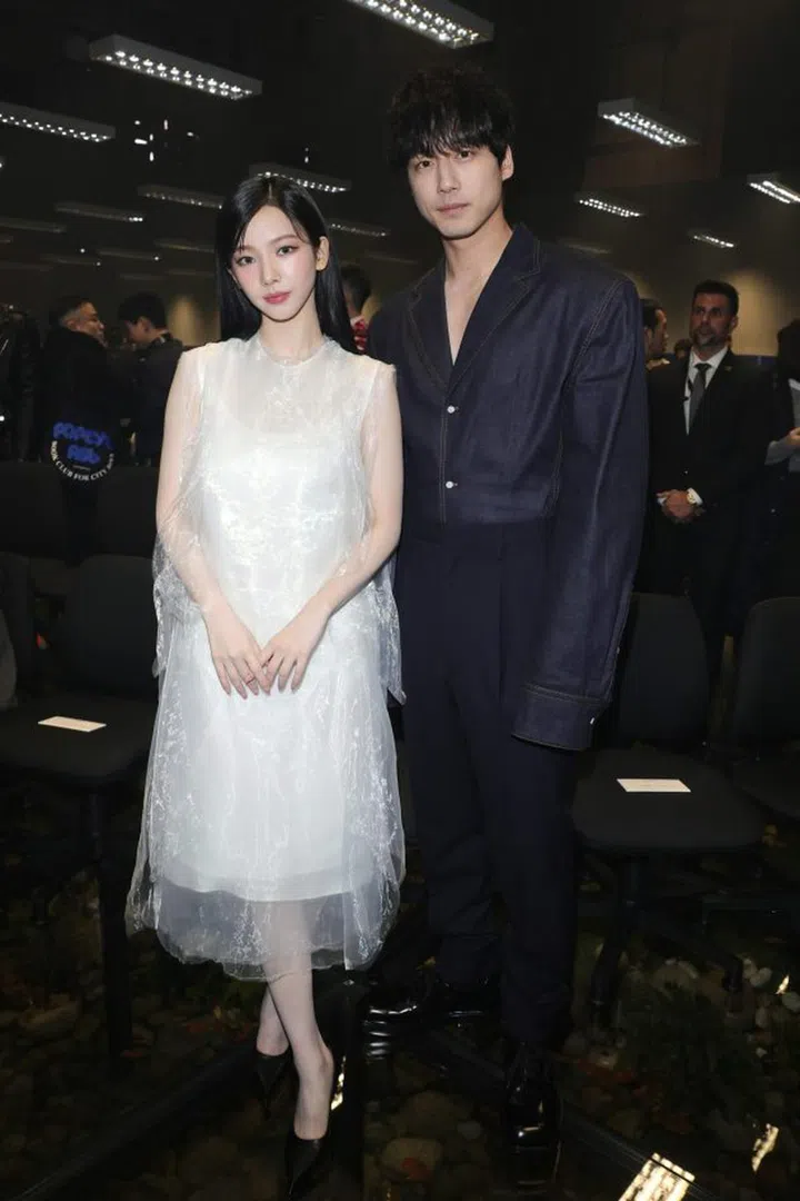 MILAN, ITALY - JANUARY 14: (EDITORS NOTE: This image has been retouched at the request of Karina.) Karina and Kentaro Sakaguchi attend the Prada Fall/Winter 2024 Menswear Fashion Show on January 14, 2024 in Milan, Italy. (Photo by Jacopo M. Raule/Getty Images for Prada)