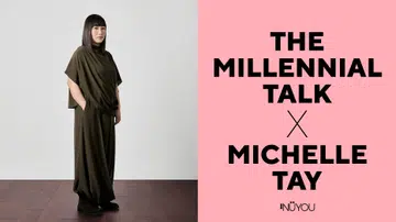 Michelle Tay 为《The Millennial Talk》专访拍摄的封面肖像照，她身穿深绿色宽松上衣与长裤，双手自然放入口袋，站立在深色木质地板上，神情沉稳内敛，目光直视镜头。背景为简洁的浅色墙面，整体构图干净，呈现她作为 Singapore Kindness Movement 执行总监，长期推动善意与社会关怀的坚定姿态。