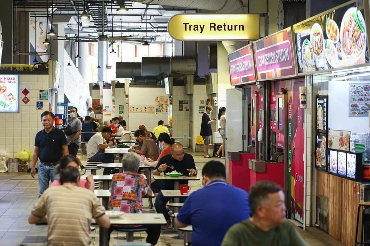 少了机器人，多了托盘归还站。（联合早报）