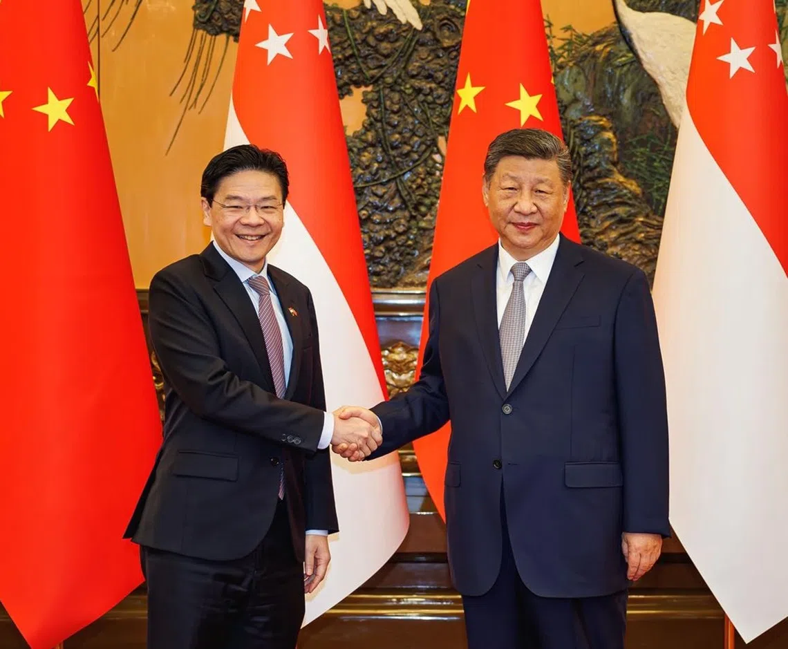 正值国际局势波谲云诡之际，黄循财总理（左）出访中国并会晤中国国家主席习近平之前所做的有关美中战略竞争的解读与评估，相信都会引起中国领导层的关注。