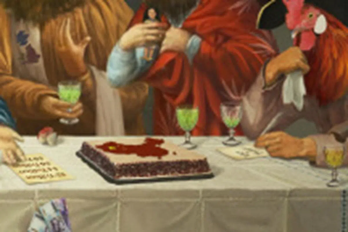  桌上摆着画上中国大陆地图的蛋糕。 