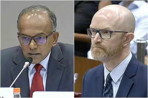 在昨天长达三小时的“拷问”中，尚穆根部长（左）和面簿亚太区公共政策副总裁西蒙·米尔纳（Simon Milner）激烈交锋。（海峡时报）