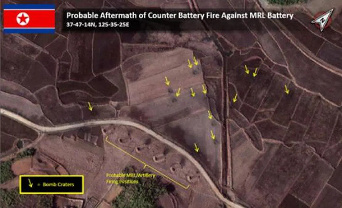 （图）根据美国安全情报智库"Stratfor"公开的延坪岛炮战卫星照，可以看出韩国军队发射的14枚炮弹落入农田，完全远离朝鲜炮兵连阵地。 