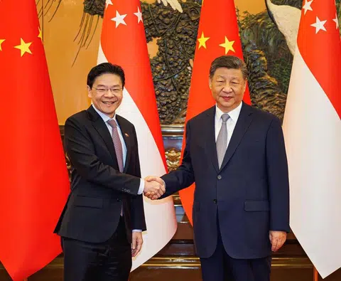 正值国际局势波谲云诡之际，黄循财总理（左）出访中国并会晤中国国家主席习近平之前所做的有关美中战略竞争的解读与评估，相信都会引起中国领导层的关注。（数码发展及新闻部）