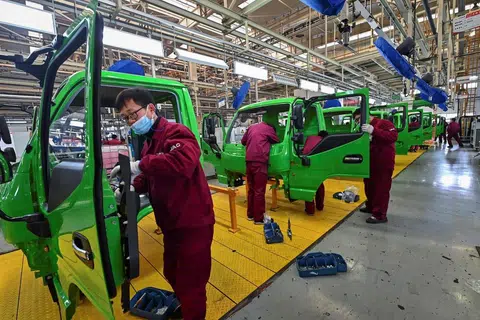冠病暴发期间，中国许多城市封城，严重影响供应链。（法新社）