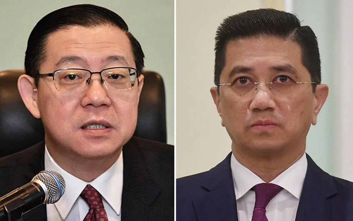 民行党秘书长、前希盟财政部长林冠英（左）认为，马国较早前已赔偿1亿多新元用于终止高铁计划，现在重提相关计划只会使马国沦为国际笑柄。他要求贸工部长阿兹敏（右）等人引咎辞职。（自由今日大马）