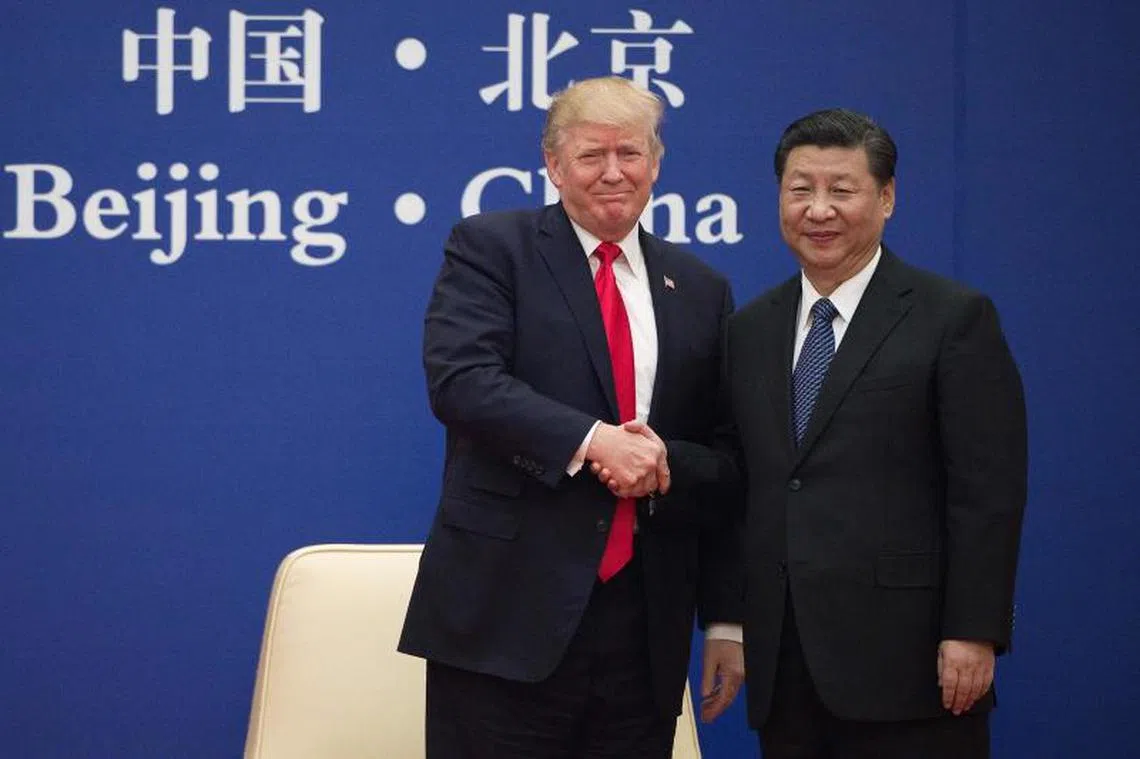 习近平与特朗普昨天出席中美企业家对话会。（法新社） 