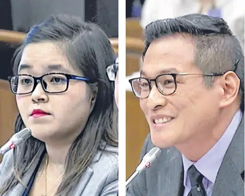 本地历史修正主义者覃炳鑫博士（右）与自由新闻工作者韩俐颖。（海峡时报）