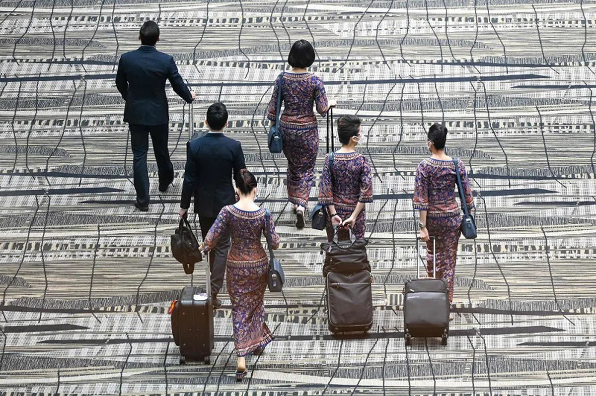新航飞机师与空服人员陆续复工。（法新社）
