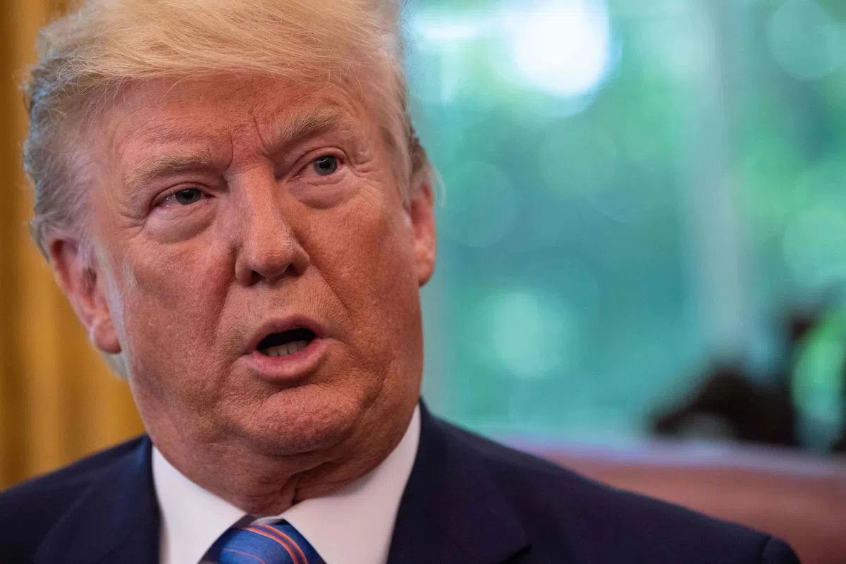  特朗普暗示自己曾跟习近平提过香港“反送中”示威一事。（法新社） 