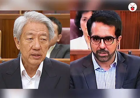 副总理张志贤（左）和工人党秘书长今天在国会上就部长薪金问题交锋。（曾庆祥制图）