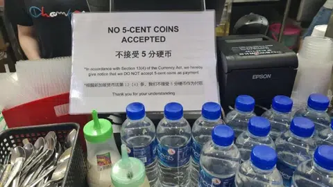 表示不接受五分钱硬币的告示。（STOMP）