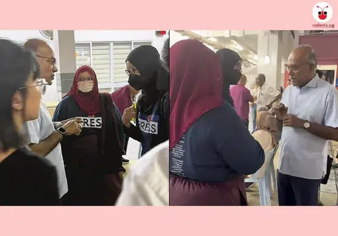 两名戴着头巾和口罩的女性，以讨论防止网络假信息和网络操纵法令为由，3月12日在律政部长兼内政部长尚穆根接见选民时到场闹事。（红蚂蚁制图）