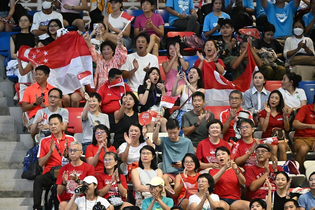 场边的支持者，同样是体坛的一分子。（海峡时报）